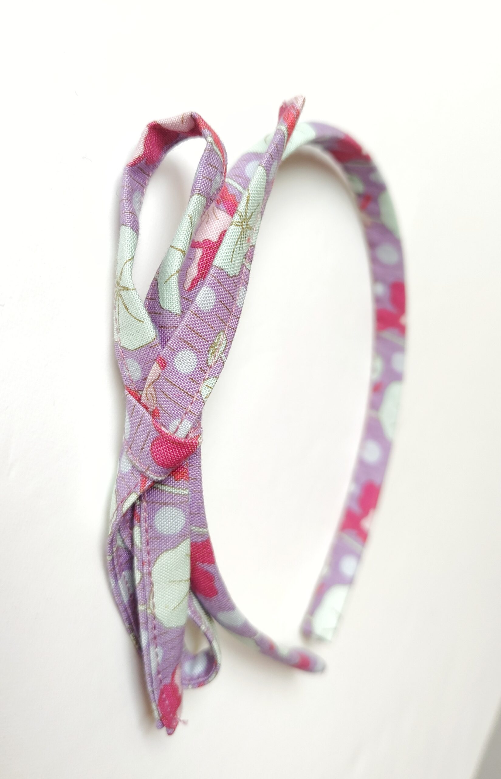 Diadema niña con lazo floral Diadema niña con lazo floral